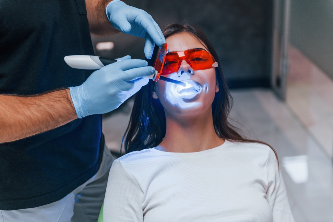 Patient receiving professional dental crowns treatment in Fullerton